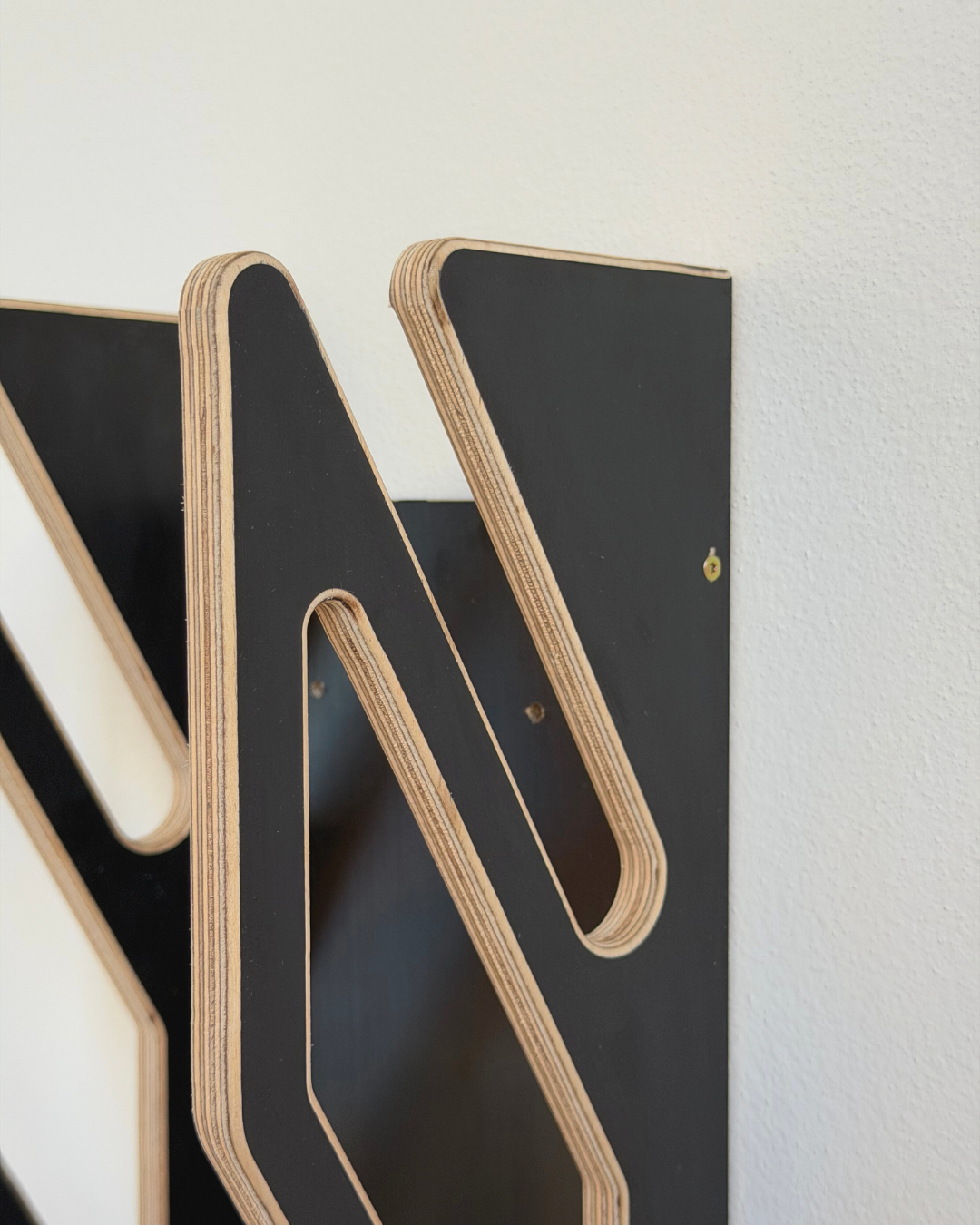 Supporto da parete nero per 2 skateboard
